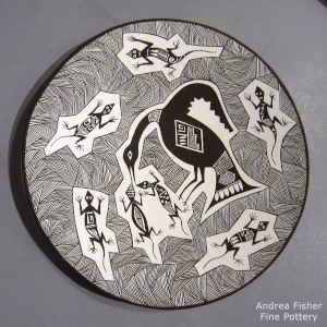 Bird, lizard, fine line and geometric design on a black and white plate