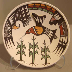 Click to see a larger version A corn plant and Mimbres-style hummingbird, shard and geometric design on a small polychrome plate