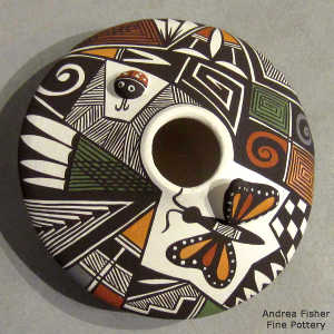 Lady bug, butterfly, fine line and geometric design on a polychrome seed pot