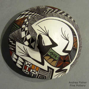 Lizard, shard and geometric design on a polychrome seed pot