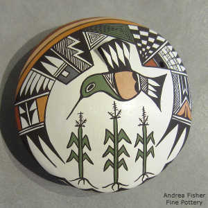 Corn plants, hummingbird and geometric design on a polychrome seed pot
