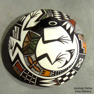 Shard, lizard and geometric design on a polychrome seed pot