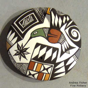 Flower, hummingbird, spiral, fine line and geometric design on a polychrome seed pot