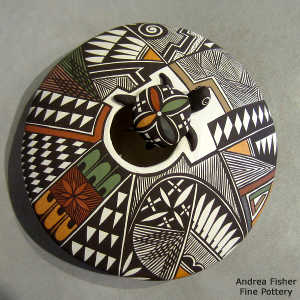Turtle, shard and geometric design on a polychrome seed pot