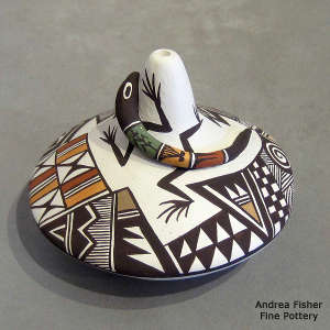Lizard and geometric design on a polychrome seed pot