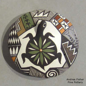 Turtle and geometric design on a polychrome seed pot