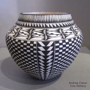 Black and white jar with a checkerboard and geometric design