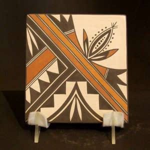 Floral design on both sides of a polychrome tile