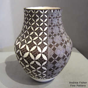 Four direction geometric design on a black and white jar