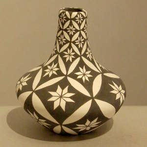 Floral design on a black and white jar