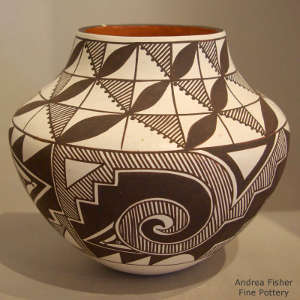 Black and white fine line and geometric design on a polychrome jar