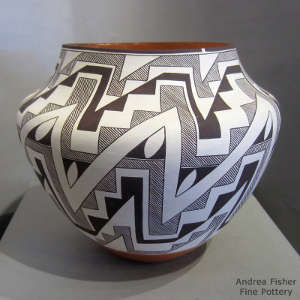 Black and white rain, kiva step and geometric design on a polychrome jar