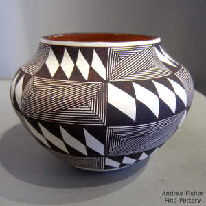 Black and white fine line and geometric design on a polychrome jar