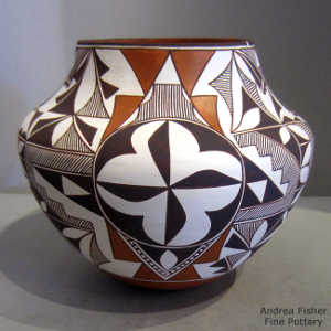 Kiva step, cloud, rain, medallion and geometric design on a polychrome jar