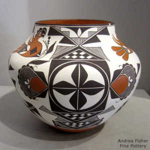 Parrot, cloud, flower, medallion, rain, checkerboard and geometric design on a polychrome jar