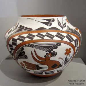 Parrot, cloud, flower, rainbow, rain, checkerboard and geometric design on a polychrome jar