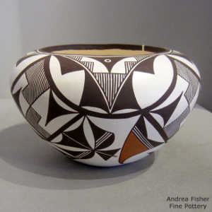 Rain, cloud, kiva step, bird elements and geometric design on a polychrome jar