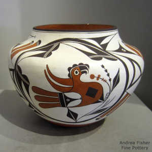 Parrot, cloud, rainbow and geometric design on a polychrome jar