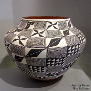 Fine line, shard and geometric design on a polychrome jar