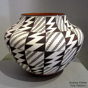 Black and white geometric design on a polychrome jar
