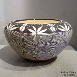 Black and white snowflake fine line and geometric design on a polychrome jar