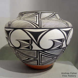 Black and white rain, cloud and geometric design on a polychrome jar