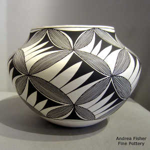 A geometric design on a black and white jar