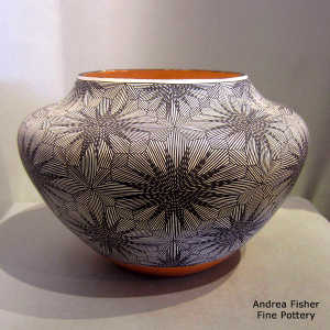 Fine line and geometric design on a polychrome jar