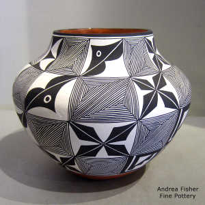 Fine line and geometric design on a polychrome jar