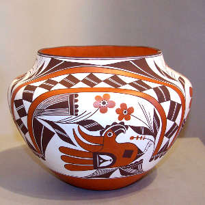 Flower, parrot, rainbow and geometric design on a polychrome jar