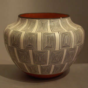 Black and white fine line scroll geometric design on a polychrome jar