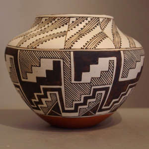 Black and white kiva step, rain and geometric design on a polychrome jar