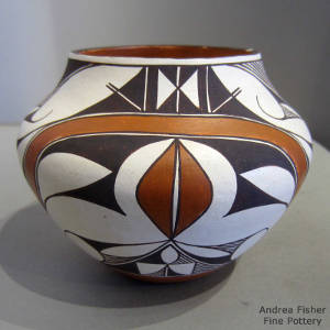 Rainbow, fine line and geometric design on a polychrome jar