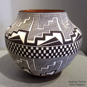 Black and white fine line, rain, kiva step and geometric designs on a polychrome jar