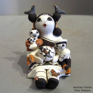 Two children, birds, butterfly, lizard and puppy on a storyteller