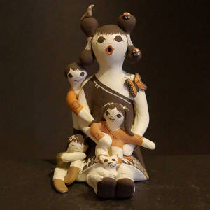 Cat, bird, butterfly, lady bugs and three children on a  female storyteller