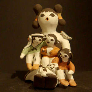 Three children, a puppy, a bird and a ladybug on a storyteller