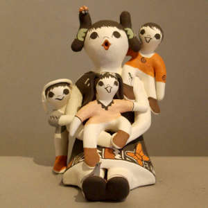 Three children on a female storyteller