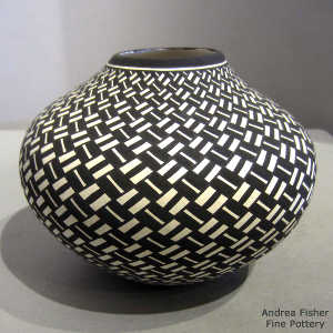 Geometric design on a black and white jar