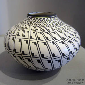 Geometric Mimbres design on a black and white jar