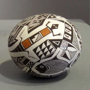 Fish, lizard and geometric design on a polychrome seed pot