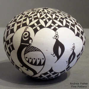 Snowflake, bird and geometric design on a black and white seed pot