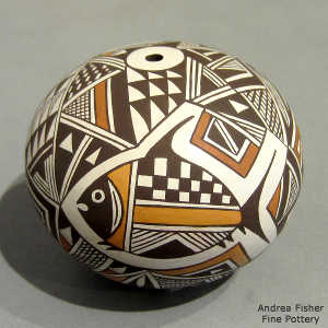 Mimbres fish, animal, shard and geometric design on a polychrome seed pot