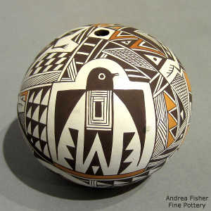 Mimbres animal, shard and geometric design on a polychrome seed pot