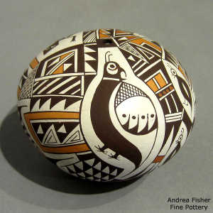Mimbres animal, shard and geometric design on a polychrome seed pot