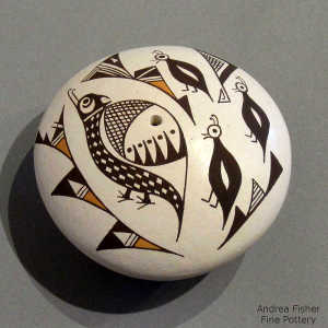 Mimbres bird and geometric design on a polychrome seed pot