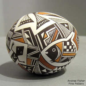 Flower, Mimbres animals and geometric design on a polychrome seed pot