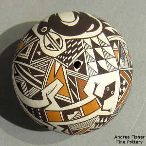 Mimbres animal, shard and geometric design on a polychrome seed pot