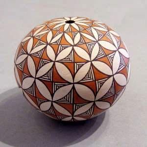 Snowflake and geometric design on a polychrome seed pot