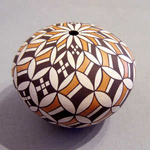Snowflake geometric design on a polychrome seed pot